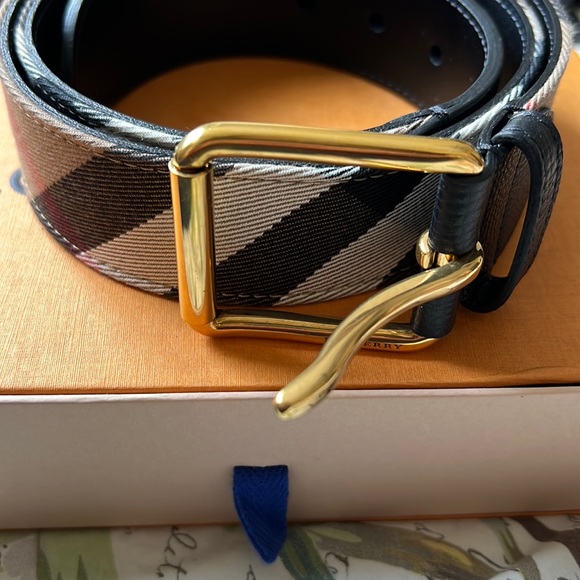 Burberry Accessories - Burberry plaid print canvas with leather interior and gold buckle.